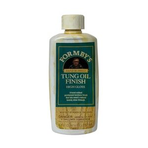 May include: A bottle of Formby's Tung Oil Finish, a high-gloss, hand-rubbed finish for wood. The label is green and white, with the brand name and product details. The bottle contains 8 fl oz (237 mL) of the product.