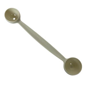 May include: A light beige, double-ended measuring spoon with a long handle. Each spoon end has a small hole. The handle has the text "Tupperware" printed on it. The kitchen utensil is designed for measuring dry ingredients.