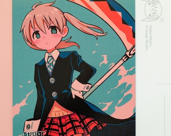 May include: A colorful illustration of a girl with blonde hair and a black and red outfit holding a large scythe. The background is a blue and pink gradient with white clouds. The image is a postcard with the text "Media Album by Sugar Studio" on the back.