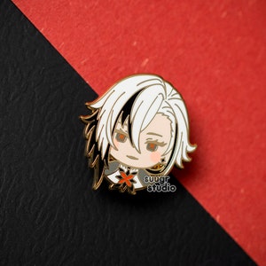 May include: Gold-colored enamel pin featuring a cartoon character with white hair, black eyes, and a red flower on their chest. The character is wearing a black and white outfit. The pin has the text "sugar studio" on the bottom.