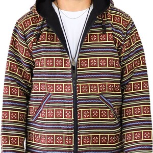 May include: A hooded jacket with a black zipper and a colorful geometric pattern in shades of red, yellow, blue, and black.