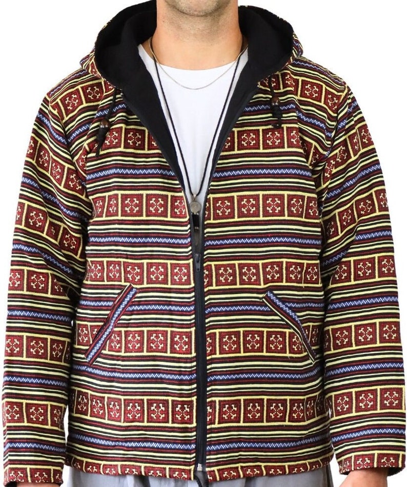 May include: A hooded jacket with a black zipper and a colorful geometric pattern in shades of red, yellow, blue, and black.