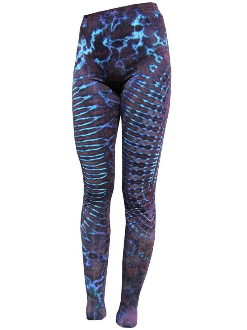 May include: Purple and blue tie-dye leggings with a unique pattern.