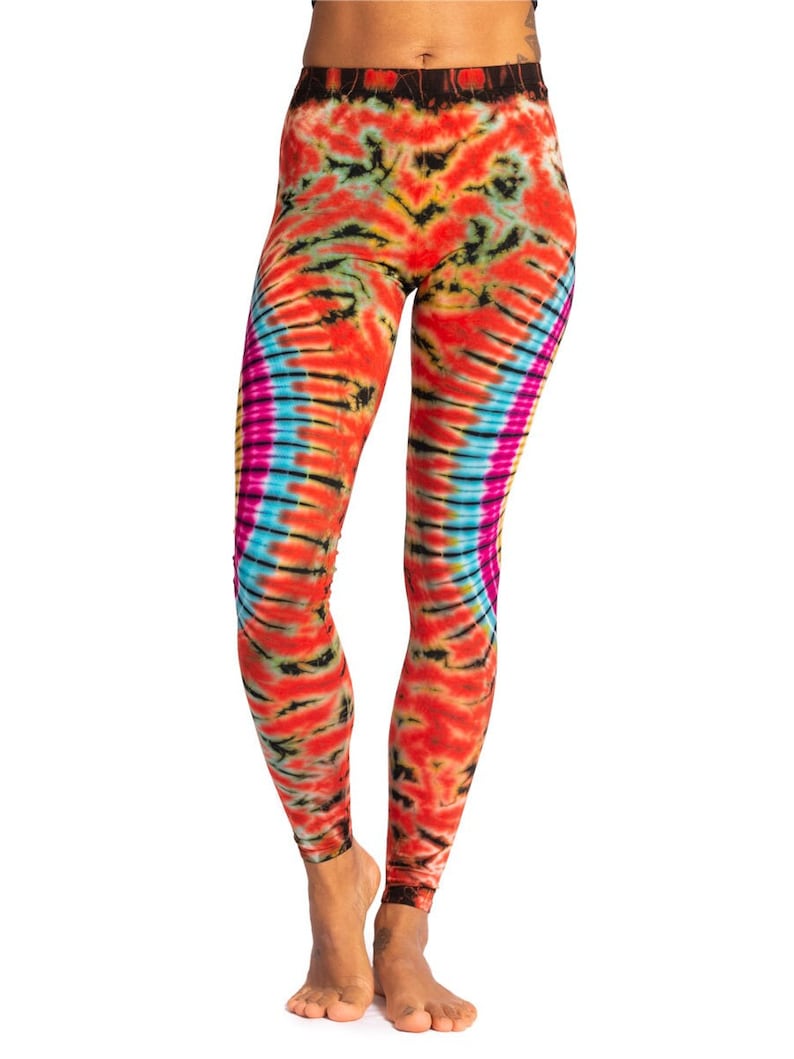 May include: Red, orange, yellow, blue, and pink tie-dye leggings. The leggings have a swirling pattern.