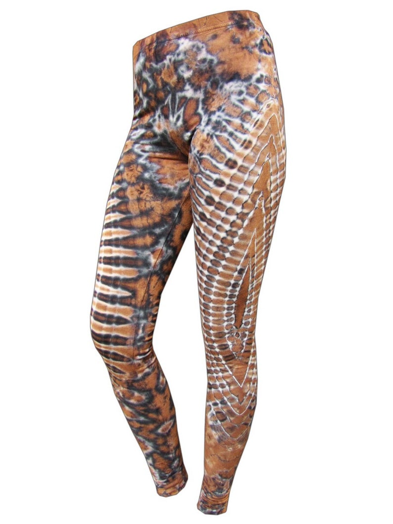 May include: Brown, black, and white patterned leggings with a tie-dye effect.