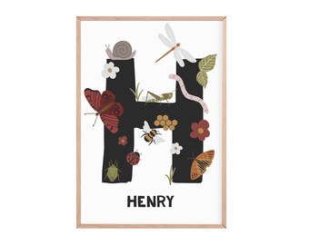 May include: A black letter H with various insects and flowers on it. The letter is on a white background with the name HENRY written below it.