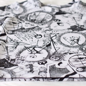 May include: Black and white t-shirt featuring a repeating pattern of characters from the film The Nightmare Before Christmas. The characters include Jack Skellington, Sally, and Oogie Boogie.