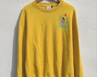 Suéteres vintage con bonito bordado amarillo de Carne Bollente, talla L.
