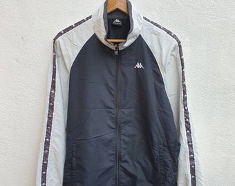 Chaqueta cortavientos ligera KAPPA estilo vintage de los 90 con monograma de cinta Kappa en las mangas y mangas raglán.
