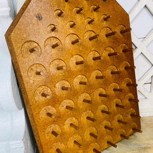 May include: A set of three ceramic mugs with a speckled, matte finish. The mugs are in shades of cream, light gray, and dark gray. Each mug has a simple, minimalist design, perfect for coffee or tea.