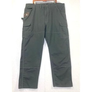 May include: Dark olive green cargo pants with multiple pockets and reinforced stitching. The pants have a straight leg design and a brown patch on the front. The pants are hanging on a wooden hanger.