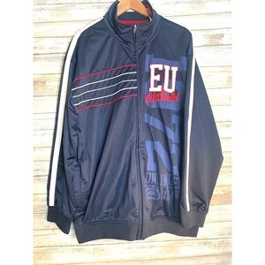 May include: Navy blue zip-up track jacket with white stripes down the sleeves. The jacket features the text "EU" in red and white, and "UNLIMITED" in blue. The jacket has a red and white striped design on the left chest.