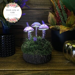 May include: Three purple and white glowing mushroom lamps with a mossy base and a tree trunk design. The lamps are lit up and have a magical fairy tale feel. The text "Work only at USB" is visible in the image.