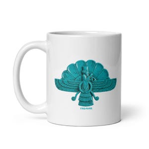 May include: A white ceramic mug featuring a turquoise-colored Faravahar symbol printed on the front. The design depicts a winged figure with a central ring and a tail, with the word FARVAHAR printed in small turquoise letters below the icon.