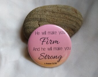 May include: Pink and orange button with the text "He will make you Firm And he will make you Strong 1 Peter 5:10"