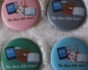 May include: Four round buttons with a green, blue, pink, and gray background. Each button features a graphic of a laptop, a coffee cup, a book, and a briefcase with the text "JW.ORG" and "The Best Life Ever!" printed on each button.