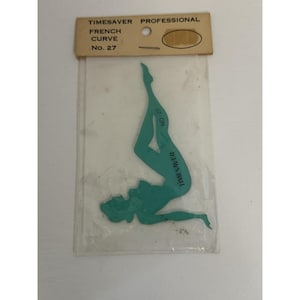May include: A teal-colored Timesaver Professional French Curve No. 27 drafting tool shaped like a reclining figure, enclosed in a clear plastic sleeve with a tan cardboard header featuring the text Timesaver Professional French Curve No. 27.