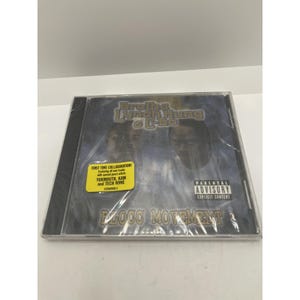 May include: A sealed CD case featuring the album "Plocc Movement" by Brotha Lynch Hung & C-Bo. The cover art displays two men's faces and the text "First Time Collaboration!" with the names of featured artists. A parental advisory warning is also visible.