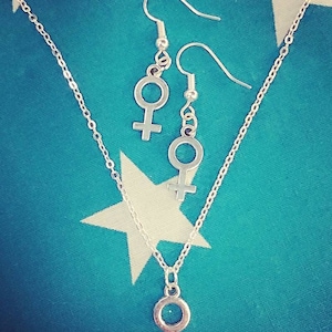 Female symbol necklace and earrings.