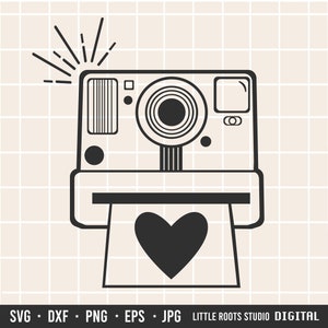 May include: Black and white illustration of an instant camera with a heart-shaped photo coming out of the film slot.