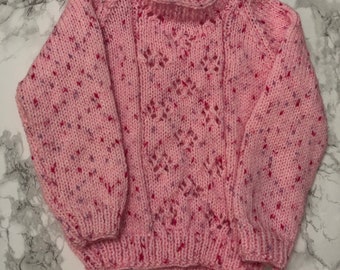 Pink hand knitted jumper