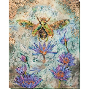 May include: A colorful beaded artwork depicting a beetle flying over a field of purple flowers. The background is a light blue with a white moon.