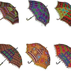 May include: A collection of ten decorative umbrellas with intricate, colorful embroidered patterns. Each umbrella features a unique design with a black handle and a decorative fringe along the edges. The umbrellas showcase a variety of colors and geometric and floral motifs.