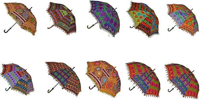 May include: A collection of ten decorative umbrellas with intricate, colorful embroidered patterns. Each umbrella features a unique design with a black handle and a decorative fringe along the edges. The umbrellas showcase a variety of colors and geometric and floral motifs.