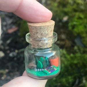 RuneScape Inspired OSRS Farming Vial with herb, seed dibber, trowel, plant pot, and farming contract