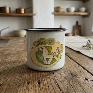 May include: A set of three ceramic mugs with a speckled, matte finish. The mugs are in shades of cream, light gray, and dark gray. Each mug has a simple, minimalist design, perfect for coffee or tea.