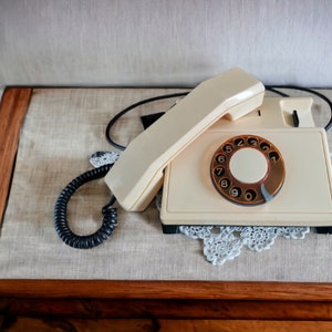 Cream rotary phone, old telephone, old desk phone, Retro phone, Dial phone, old fashioned phone, old landline phone, vintage technology