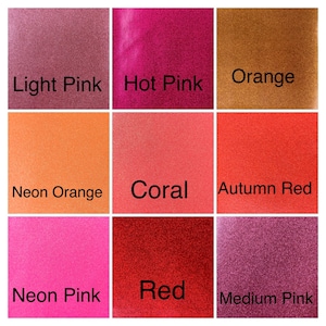 May include: Nine color swatches of glitter paint in various shades of pink, orange, and red. The colors are labeled: Light Pink, Hot Pink, Orange, Neon Orange, Coral, Autumn Red, Neon Pink, Red, and Medium Pink.