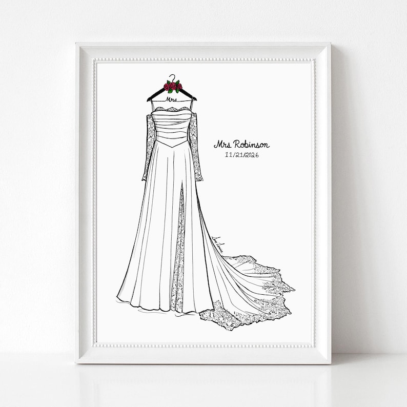 May include: A framed line art illustration of a strapless wedding dress with long lace sleeves, a side slit, and a train. The dress hangs on a hanger with red roses and the text Mrs. The print includes the text Mrs. Robinson and 11/21/2026.
