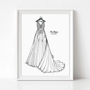 May include: A framed black and white line art illustration of a wedding dress hanging on a hanger. The dress features a V-neckline, intricate bodice detailing, and a long flowing skirt. The text Mrs. Hogan and 06/15/2024 is printed on the right.