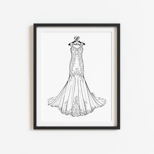 May include: A black and white line art illustration of a floor-length gown with a flared skirt and intricate floral embroidery details. The dress hangs on a hanger featuring a small bow and the handwritten text Mrs. Ritz, all inside a black frame.