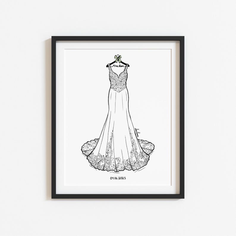 May include: A framed black and white line art illustration of a floor-length wedding dress on a hanger. The hanger features a small bow and the text Mrs. Rose. The date 04.06.2025 is printed at the bottom of the white paper within the black frame.