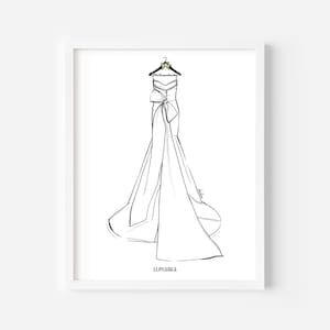 May include: A black and white line art illustration of a strapless gown with a large bow at the waist and a long train, hanging on a hanger labeled Mrs. Lewandowski. The date 11.04.2022 is printed in black text at the bottom of the framed print.