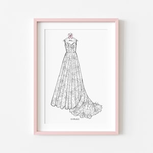May include: A framed line art illustration of a strapless gown with a lace pattern, hanging on a hanger with a small pink bow. The word Mrs is written on the hanger, and the date 10.08.2023 is printed at the bottom of the white paper.