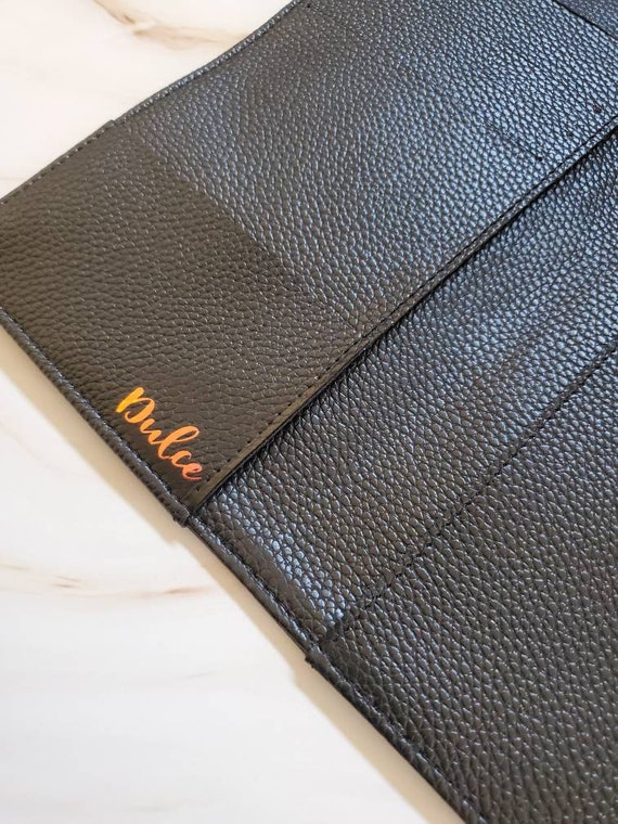 A bespoke vegan leather wallet-style cover for the cult Hobonichi Weeks planner — niche enough to make a stationery lover genuinely gasp.