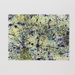 May include: Abstract painting with a yellow background and black, blue, and green splatters of paint.