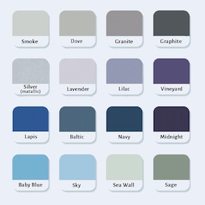 May include: A color chart featuring sixteen rounded square swatches arranged in a four-by-four grid. Each swatch displays a unique shade labeled with text below it, including Smoke, Dove, Granite, Graphite, Silver, Lavender, Lilac, Vineyard, Lapis, Baltic, Navy, Midnight, Baby Blue, Sky, Sea Wall, and Sage.