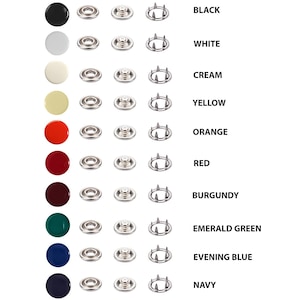 May include: A collection of snap fasteners in various colors, including black, white, cream, yellow, orange, red, burgundy, emerald green, evening blue, and navy. Each snap set includes a cap and a pronged base.