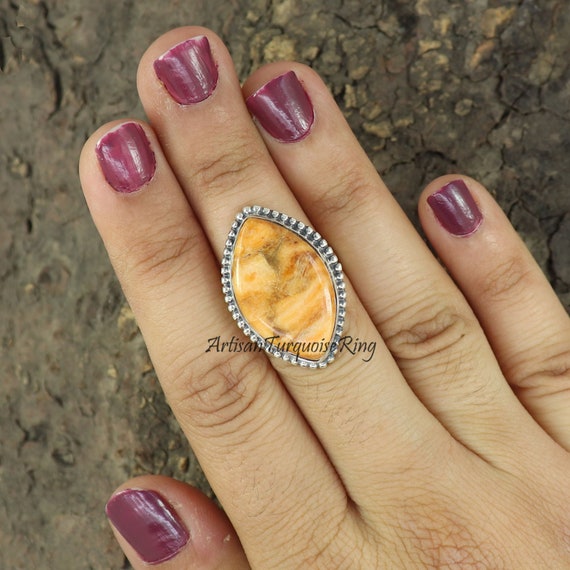 Copper ring in middle finger best sale