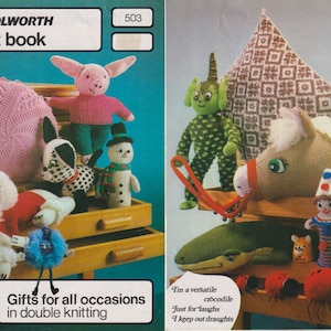 May include: A book of knitting patterns for making stuffed toys. The cover features a variety of knitted toys, including a pig, a snowman, a dog, a unicorn, a crocodile, and a clown. The book is titled "Woolworth Gift Book" and has the number 503 on the cover.