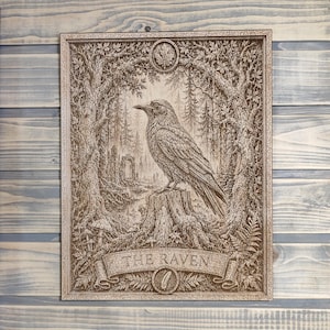 May include: A rectangular wooden plaque featuring a detailed laser-engraved illustration of a raven perched on a tree stump. The scene includes a forest background, foliage, and a banner at the bottom with the text THE RAVEN and a feather icon.