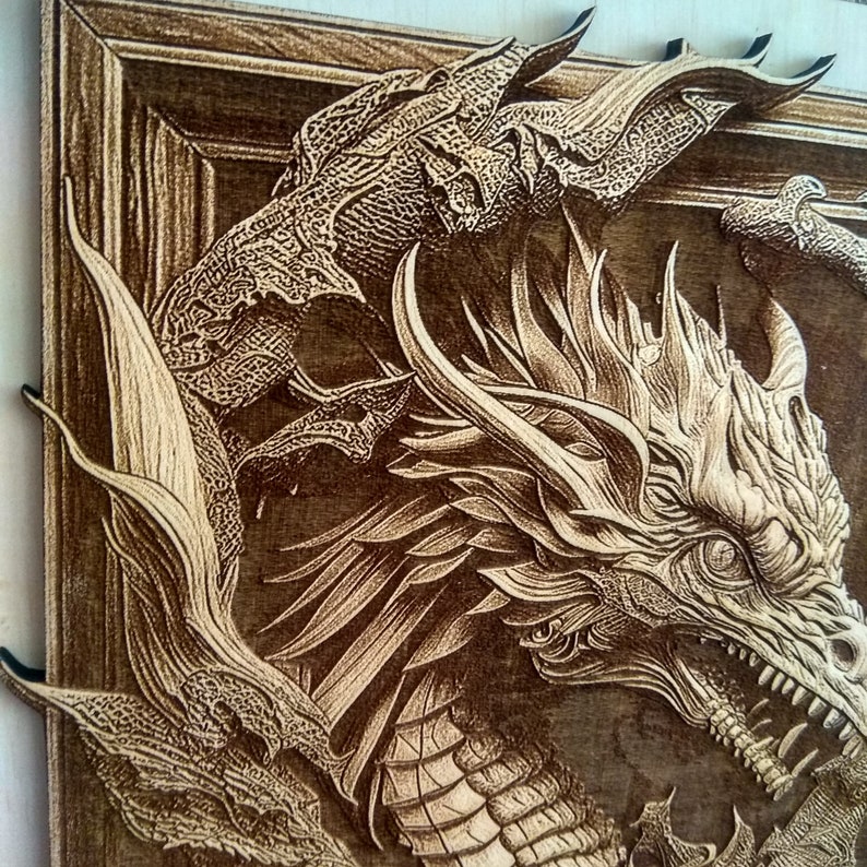 May include: A detailed wood carving of a dragon's head with intricate scales and sharp teeth. The dragon is set against a wood background with a frame.