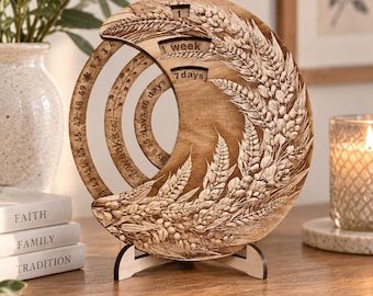 May include: A circular wooden perpetual calendar featuring intricate laser-engraved wheat stalks. The design includes concentric rings with numbers and text such as 1 week, 7 days, and 49 days. It stands on a small wooden base with a natural finish.