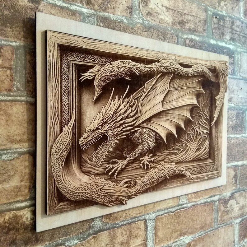 May include: A wooden wall art piece featuring a detailed carving of a dragon with its wings spread wide. The dragon is set within a frame with intricate carvings around the edges.