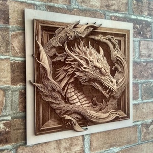 May include: A wooden wall art piece featuring a detailed carving of a dragon's head emerging from a swirling pattern. The dragon is carved in a light brown wood and has a fierce expression.