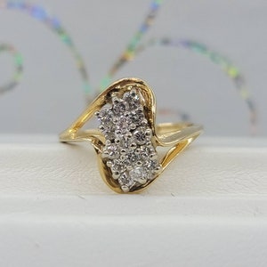 Vintage Estate 14k yellow gold and white gold .45ctw SI2-I1/H-J. Diamond cluster bypass split shank fashion ring. Size 5, 2.9 grams.